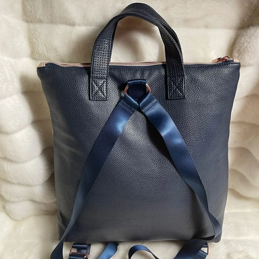 Caboodle Navy blue and beige computer backpack with rose gold hardwares